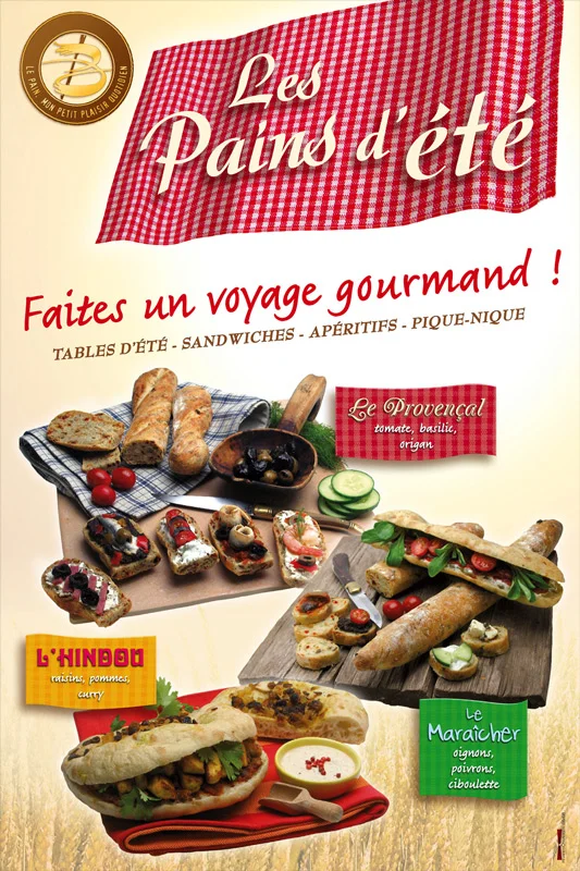 Affiche publicitaire Les Pains d'&eacute;t&eacute; pr&eacute;sentant une vari&eacute;t&eacute; de pains garnis, sandwiches et bruschettas sur des planches en bois